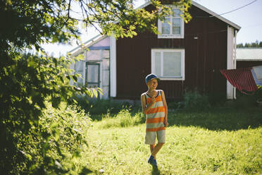 Boy in garden - JOHF04914