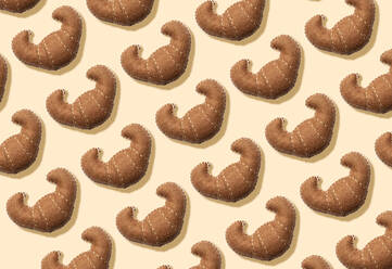 3D Illustration, Plush fake croissants pattern on cream background - GEMF03342