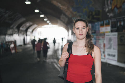 Young woman at an underpass in the city stock photo