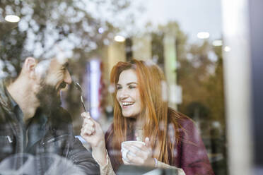 Couple in love having fun together in a coffee shop - LJF01149