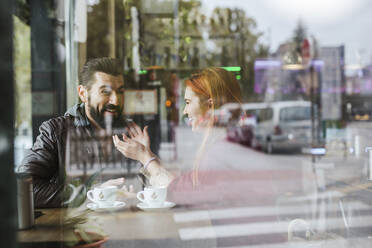 Couple having fun together in a coffee shop - LJF01151