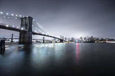 USA, New York, Brooklyn bridge at night - DAMF00229