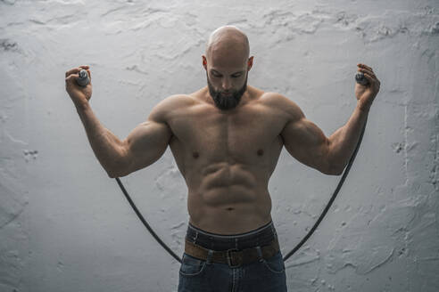 Portrait of a barechested athlete with rope - DLTSF00332