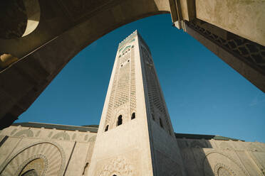 Low angle view of Mosque Hassan II against clear sky - CAVF70770