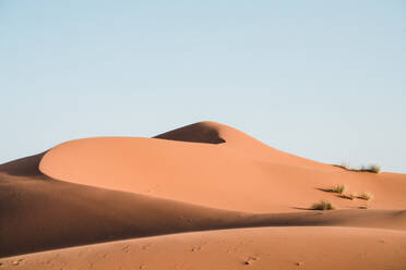 Idyllic view of sand dunes against clear sky - CAVF70784