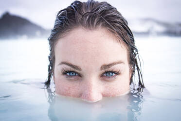 Portrait of woman swimming in sea - CAVF70852