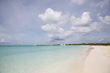 Scenic view of beach against cloudy sky - CAVF70871