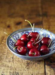 Close-up of cherries in bowl on table - CAVF70908