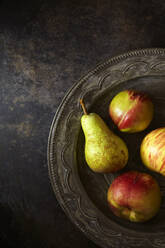 Overhead view of apples and pear in metallic plate - CAVF70912