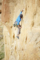 Full length of man climbing mountain - CAVF71120