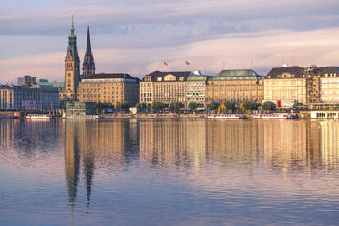 Germany, Hamburg, Town hall seen across Alster lake at sunset - IHF00200