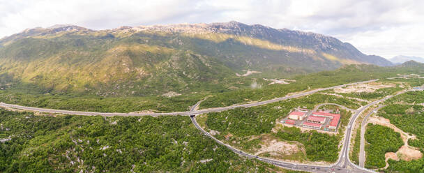 Panoramic aerial view of highway E65 crossing Blato Na Cetini, Croatia. - AAEF06291