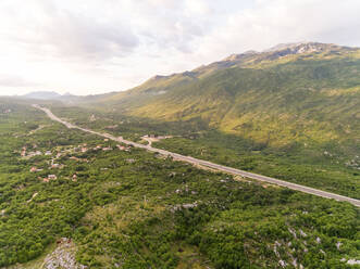 Aerial view of highway E65 crossing Blato Na Cetini, Croatia. - AAEF06292
