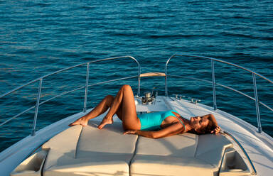 Woman relaxing on yacht - CUF54158