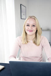 Young woman working at office - JOHF05086