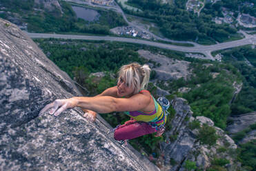 Rock climber ascending Heatwave, The Chief, Squamish, Canada - ISF23475