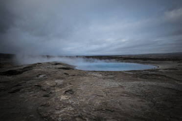 Scenic view of hot spring against sky - CAVF72411