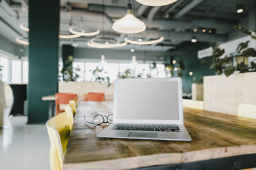 Business, Laptop and glasses in coworking office - KNSF06989