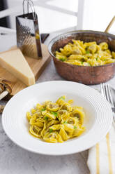 Plate of Italian tortellini with grana cheese - GIOF07897