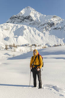 Hiking with snowshoes in the mountains, Valmalenco, Sondrio, Italy - MCVF00134