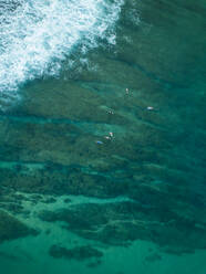 Indonesia, Sumbawa, Aerial view of group of surfers - KNTF03802