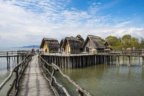 Germany, Unteruhldingen, Stilt houses on Lake Constance open-air archeological museum - RUNF03487