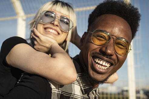 Portrait of laughing young man having fun with his girlfriend - RCPF00178