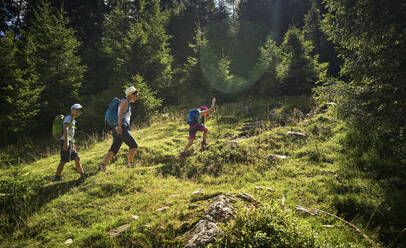 Mother with two children hiking in alpine scenery, Passeier Valley, South Tyrol, Italy - DIKF00315