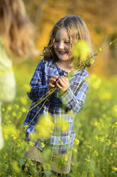 Girl picking flowers - ECPF00822