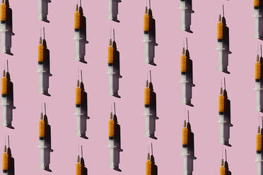 3D Illustration of syringes, pink background - ERRF02406