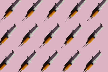 3D Illustration of syringes, pink background - ERRF02408