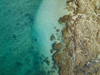 Aerial view of surfer, Sumbawa, Indonesia - KNTF03871