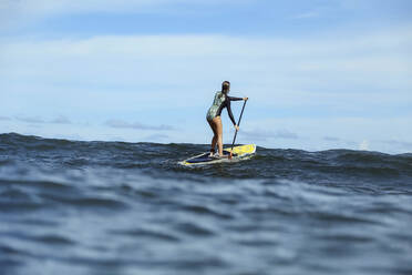 Female SUP surfer, Bali, Indonesia - KNTF03905