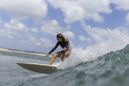 Female Surfer, Bali, Indonesia - KNTF03913