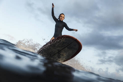 Female Surfer, Bali, Indonesia - KNTF03914