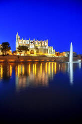 Spain, Palma de Mallorca, Palma Cathedral illuminated at dusk - PUF01789