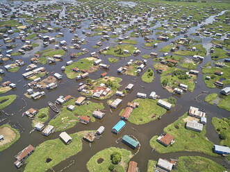 Aerial view of people working on a floating platform for fishing