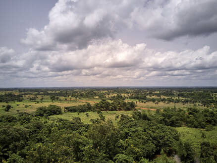 Benin, Large white clouds over green African landscape - VEGF01261
