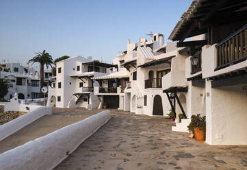 Spain, Menorca, Binibeca, Whitewashed houses - RAEF02313