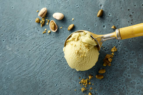 Pistachio ice cream on scoop and nuts - DREF00009