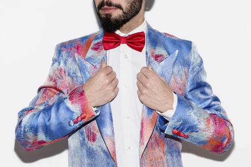 Stylish man wearing a colorful suit and a red bow tie - LOTF00084