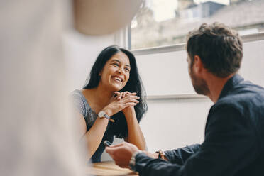 Couple talking in restaurant - CUF54405