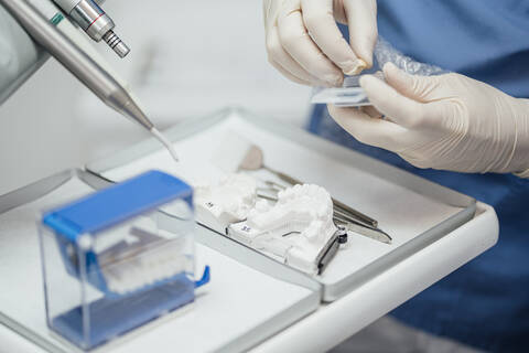 Close-up of dentist working on dentures stock photo