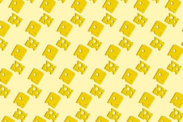 Slices of cheese pattern on yellow background - GEMF03392