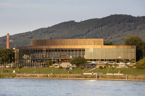 Austria, Upper Austria, Linz, Brucknerhaus festival and congress centre seen across Danube river - WIF04172