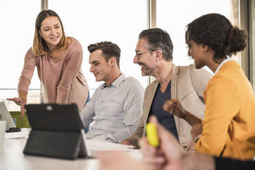 Business people having a meeting in office - UUF19987