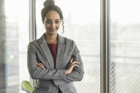 Portrait of a confident young businesswoman in office stock photo