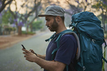 Backpacker waking in the street, Pretoria, South Africa - VEGF01265