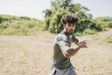 Young man during workout in park - FBAF01207