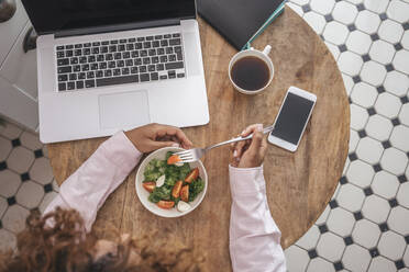 Top view of young businesswoman having lunch break at home - VPIF01963